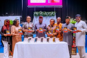 Gocernor Oyebanji unveiling a book titled “Kick the Habit”, authored by Eno-Udoma Eniang
