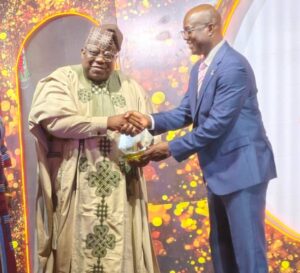 Prof. Tunji Olaopa, Chairman, Federal Civil Service Commission, receiving the Oyo State Merit Award from HE Governor Seyi Makinde in Ibadan on Tuesday, to mark the Grand Finale of Oyo State at 50 Anniversary.