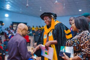 Professor Yiwaltda making the donation