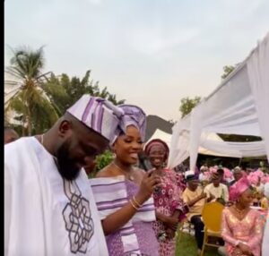 The bride presents her groom to her family, honoring tradition and the coming together of two families.
