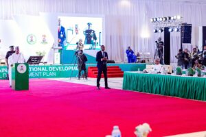 VP Shettima speaking, right, Seantor Bagudu, sitting to the right
