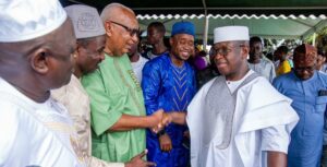 President Bio greeting people of different religions faith, including John Benjamin, a Christian and former Finance Minister, after the Eid prayer yesterday