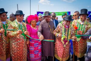 President Tinubu commissioning one of the projects, while Senate President Akpabio, former President Jonathan, Governor Diri and others look on