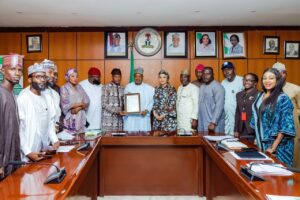 Senator Bagudu receiving the letter of his appointment as a patron