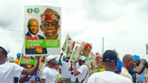 Supporters holding the posters showing Prsident Tinubu and Tunde Lemo