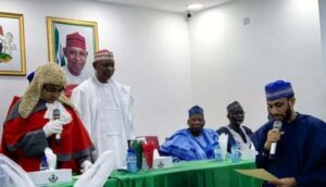 Murtala Sule Garo taking Oath of Office as the new Kano Deputy Governor, while Governor Yusuf and immediate past National chairman of APC, Dr. Abdullahi Umar Ganduje watch with keen interest