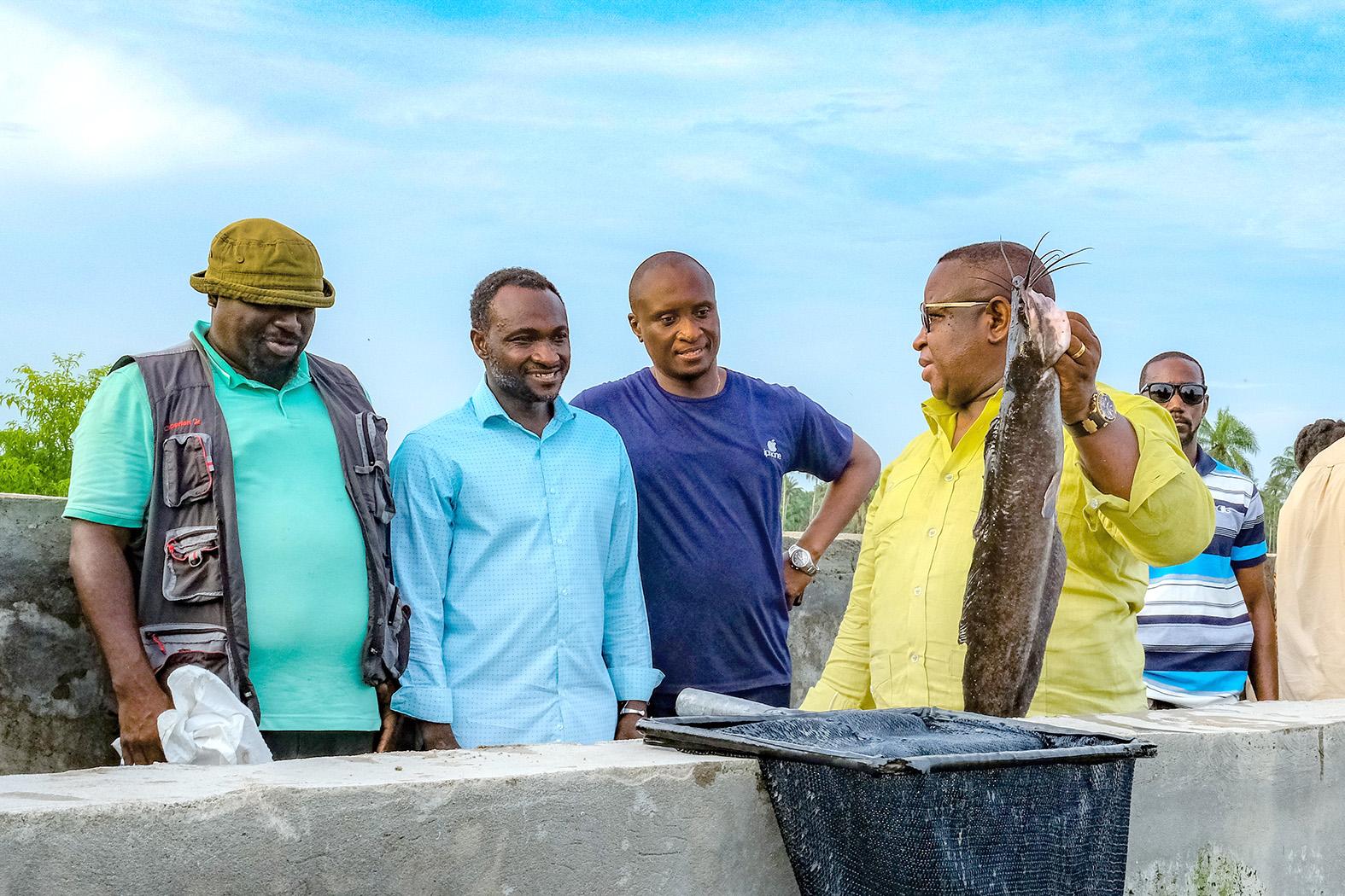 •President Bio, displaying local fish production