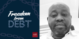 Steve Aborisade, right, and the Freedom from Debt campaign logo