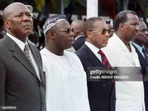 Obasanjo, center, with Tejan Kabbah, left, and Charles Taylor, right, after peace restored in both countries